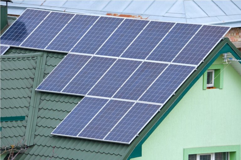 aerial view building roof with rows of blue solar 2023 02 10 08 33 25 utc