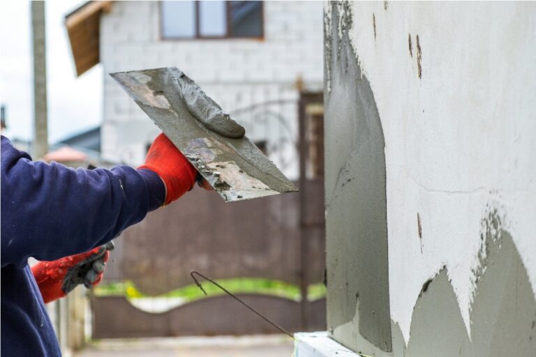 construction worker covering house wall with adhes 2023 03 22 03 35 17 utc