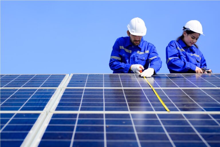 solar panel station, engineer installing solar panel at solar energy farm field