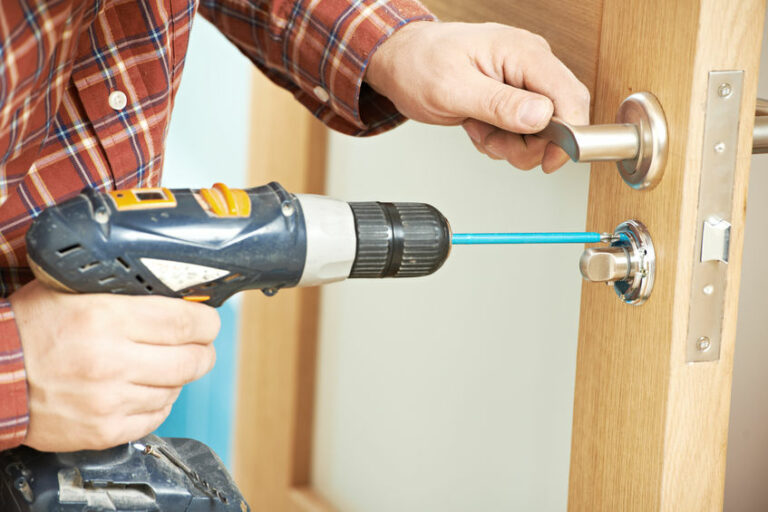 carpenter at door lock installation
