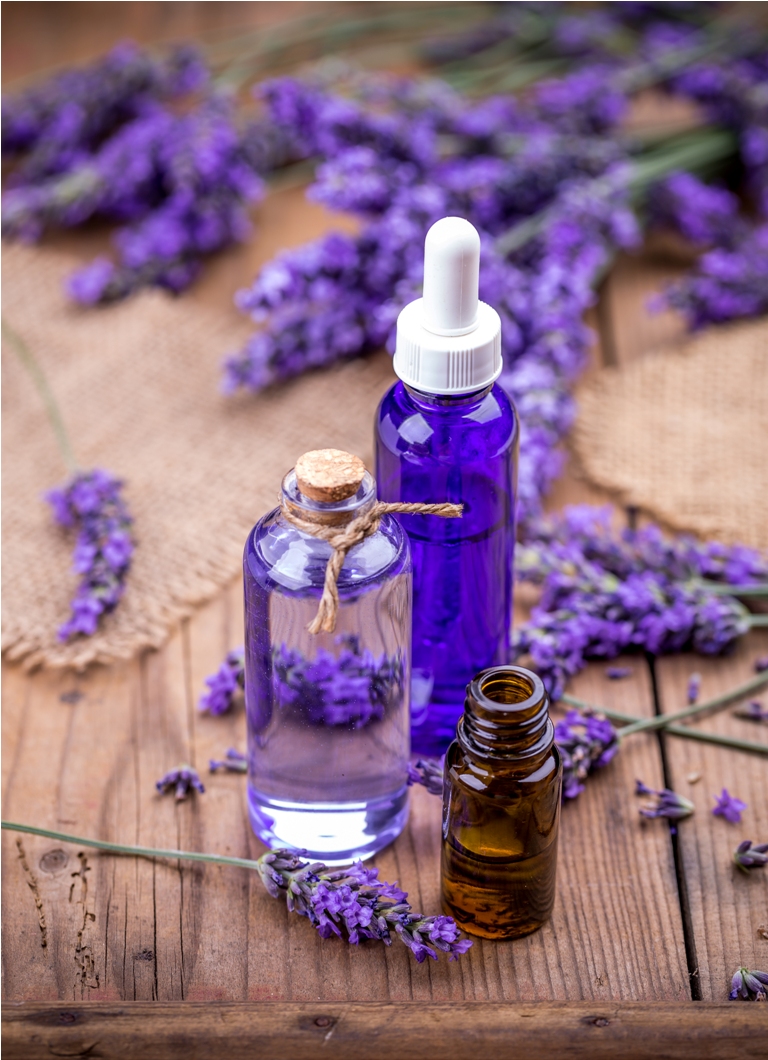 wellness treatments with lavender flowers and essential oils