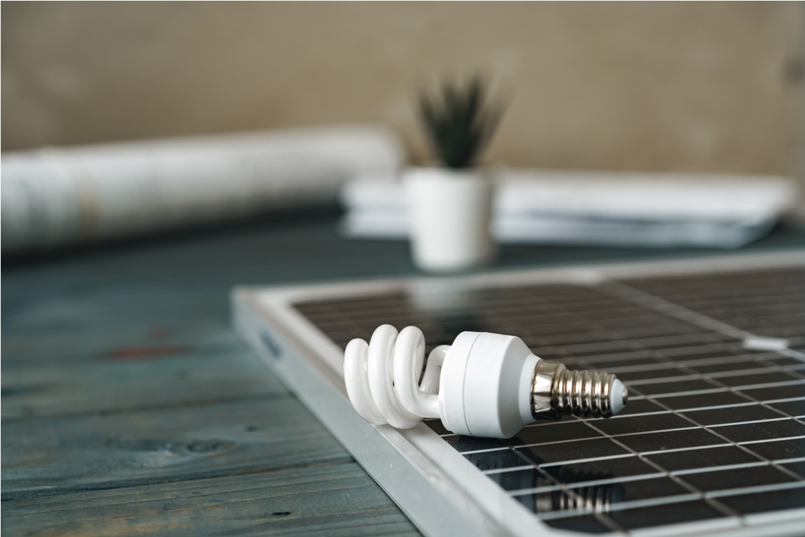 solar energy panel and light bulb, green energy