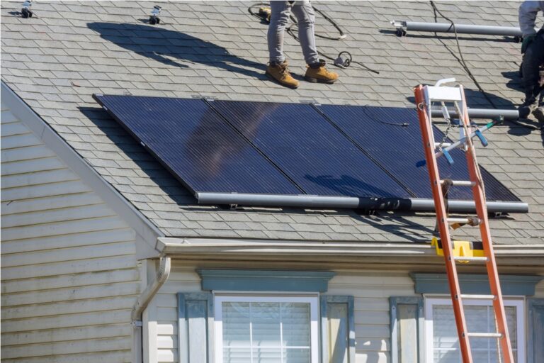installed solar panels in use on roof of home for alternative energy