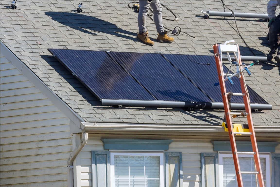 installed solar panels in use on roof of home for alternative energy