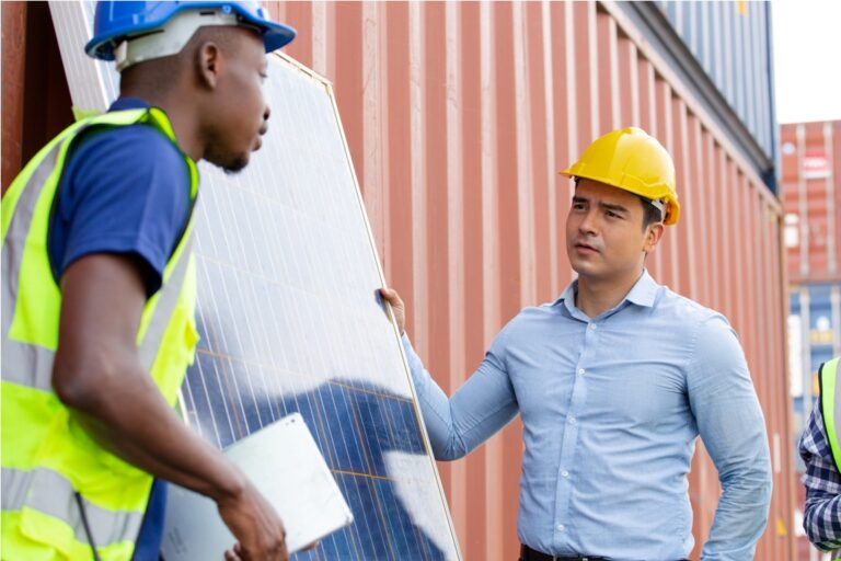 engineer worker presenting and showing solar cell panel to customer