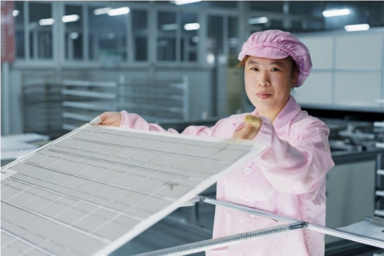 female worker in solar panel assembly factory, solar valley, dezhou, china