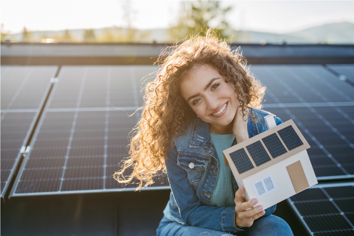 portrait of young woman on roof with solar panels 2023 05 30 20 32 54 utc