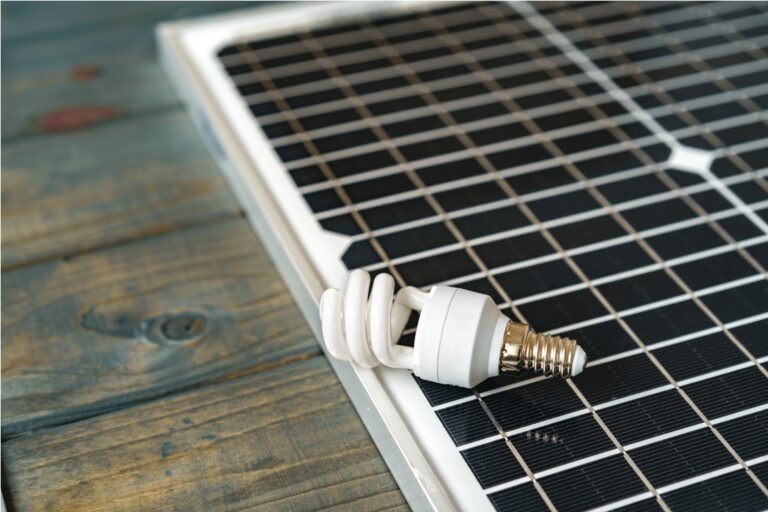 solar energy panel and light bulb, green energy