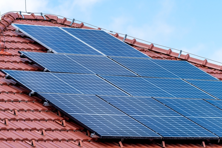 solar panels on the roof of the house to produce energy from sunlight